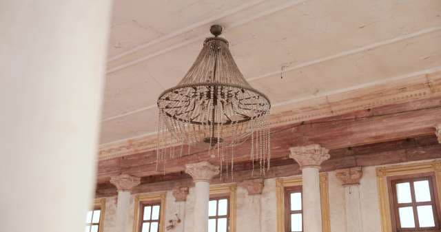 Elegant Antique Chandelier in Historic Architectural Setting