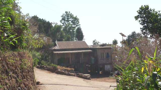 Traditional Rural Wooden House in Lush Village Landscape Kongthong Village Meghalaya