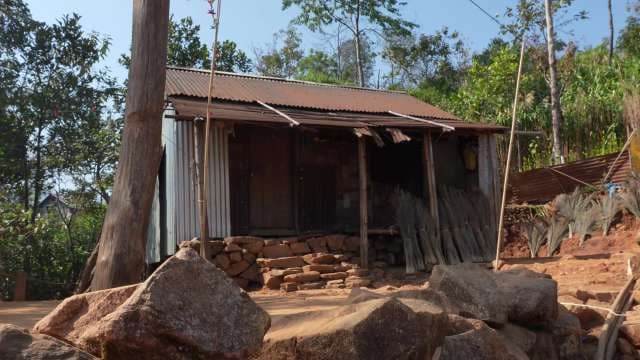 Rural Rustic House With Corrugated Metal Roof in Countryside