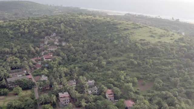Breathtaking Aerial View of Serene Coastal Village