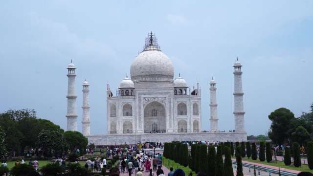 Taj Mahal Landmark with Crowds and Dome Scaffolding in Agra India