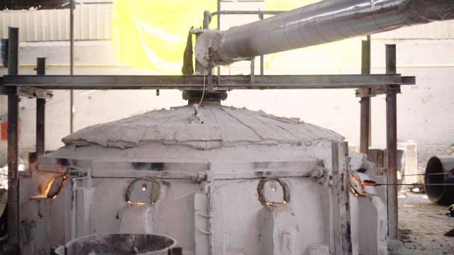 Industrial Kiln with Glowing Vents in Glass Factory