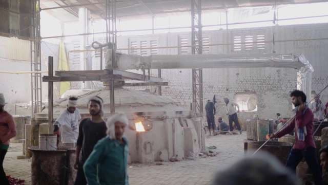 Indian Workers In Traditional Glass Manufacturing Factory