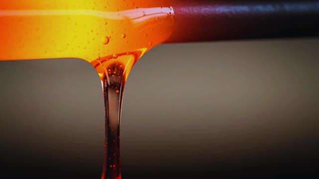 Extreme Macro of Thick Golden Honey Dripping