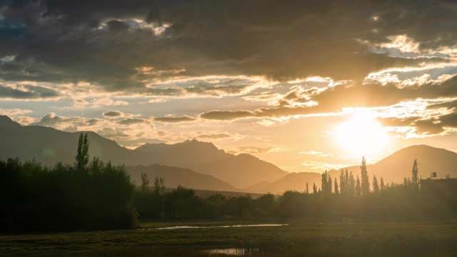 Majestic Golden Sunset Over Silhouette Mountain Peaks and Valley