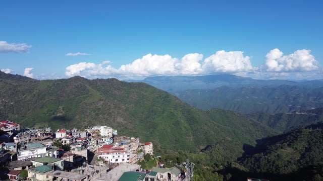 Scenic Aerial View of Hill Station Town in Green Mountains
