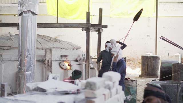 Traditional Glass Blowers Working at Hot Furnace in India