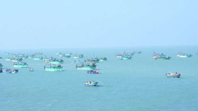 Fleet of Traditional Fishing Trawlers Anchored in Calm Turquoise Sea