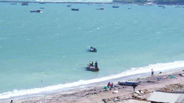 Traditional Fishing Boats on Turquoise Tropical Coastline