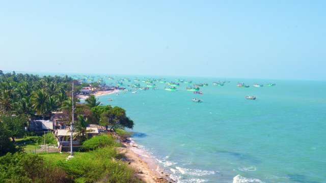 Aerial View of Fishing Boats Anchored Near Tropical Coast